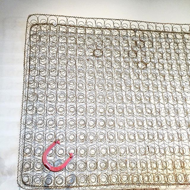 The vintage mattress springs on our wall remind us that beauty and art can be found in the most unexpected places.