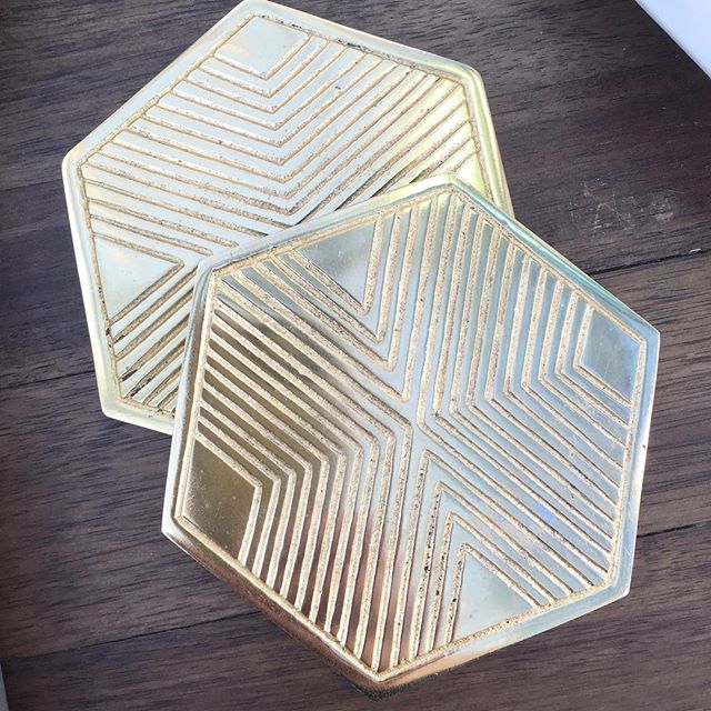 Brass hex coasters in sets of four.  Stop by and see them in person. We're open today from 11-6.